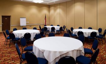 a large conference room with multiple round tables and chairs , all set up for a meeting at Courtyard Carolina Beach Oceanfront