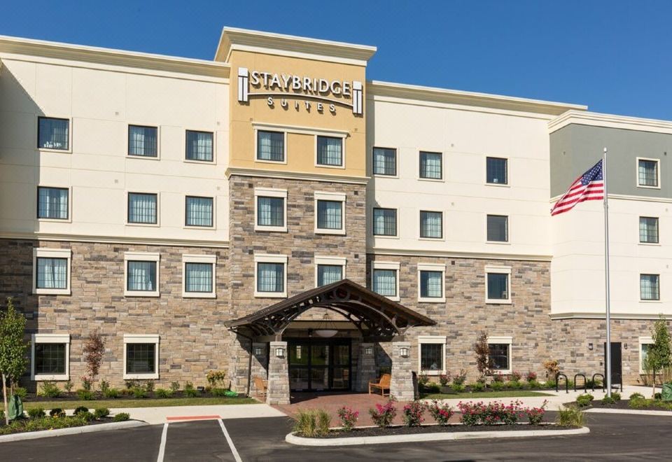 "a large hotel with a stone building and the words "" staybridge suites "" written on it" at Staybridge Suites Washington DC East - Largo