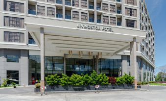 "the exterior of a building with a large sign that says "" luxton hotel "" and several people walking in front" at Livingston Hotel