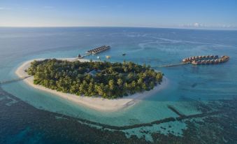 aerial view of an island surrounded by the ocean , with a small island in the distance at Angaga Island Resort & Spa