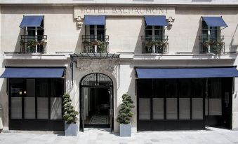 "the exterior of a hotel that is named "" hotel bascomb "" in france , with its name written above the entrance and balcony" at Hotel Bachaumont