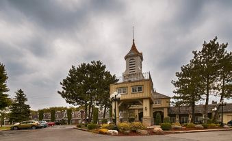 "a large , ornate building with a clock tower and a sign that reads "" northstar golf club .""." at Best Western Parkway Inn  Conference Centre