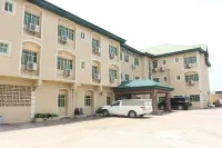 New Point Hotel and Suites Hotels near Sufficient Grace Worship Centre
