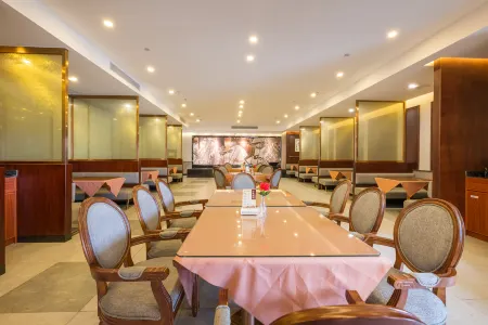 Haonianhua Business Hotel Отели рядом с достопримечательностью «Coconut Grand View Garden»