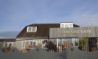 "a large building with a sign that says "" stamford "" on it , located in a residential area" at Stamford Gate Hotel