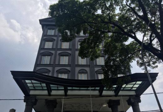 D'Primahotel Bandung의 편안한 침실 공간