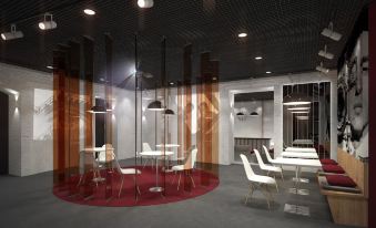 a modern conference room with white chairs , a red rug , and large windows , creating an open and airy atmosphere at Fabrika