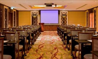 A spacious room is set up with tables and chairs for an event or conference at Sofitel Macau at Sofitel Macau at Ponte 16