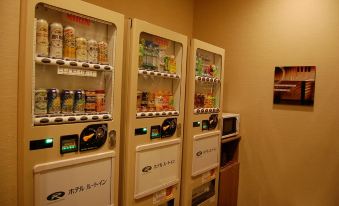 a hotel room with two vending machines , one on the left side and the other on the right side at Route Inn Grantia Hakodate Ekimae