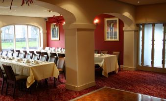 a dining room with tables and chairs arranged for a group of people to enjoy a meal together at The Gibside Hotel