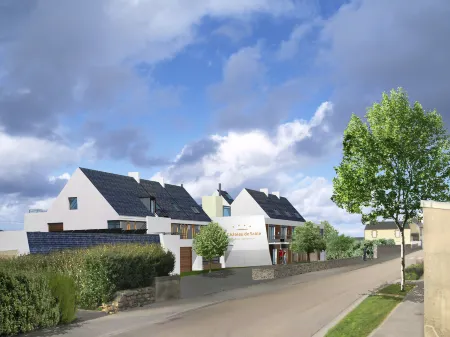 Logis le Château de Sable Отели в г. Порсподе