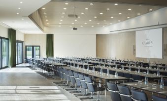 a large conference room with rows of chairs and tables set up for a meeting or event at Camiral Golf & Wellness - Leading Hotel of the World