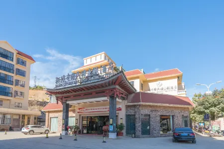 Mijng Qiyuan Minority Theme Hotel Отели в г. Моцзян