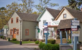 a small town with a variety of shops and buildings , some of which are for sale at Colonial Inn