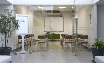 an empty conference room with rows of chairs and a whiteboard , ready for a meeting or presentation at Casa Andina Standard Talara