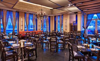 a large dining room with multiple tables and chairs arranged for a group of people to enjoy a meal together at The Westin Riverfront Resort & Spa, Avon, Vail Valley