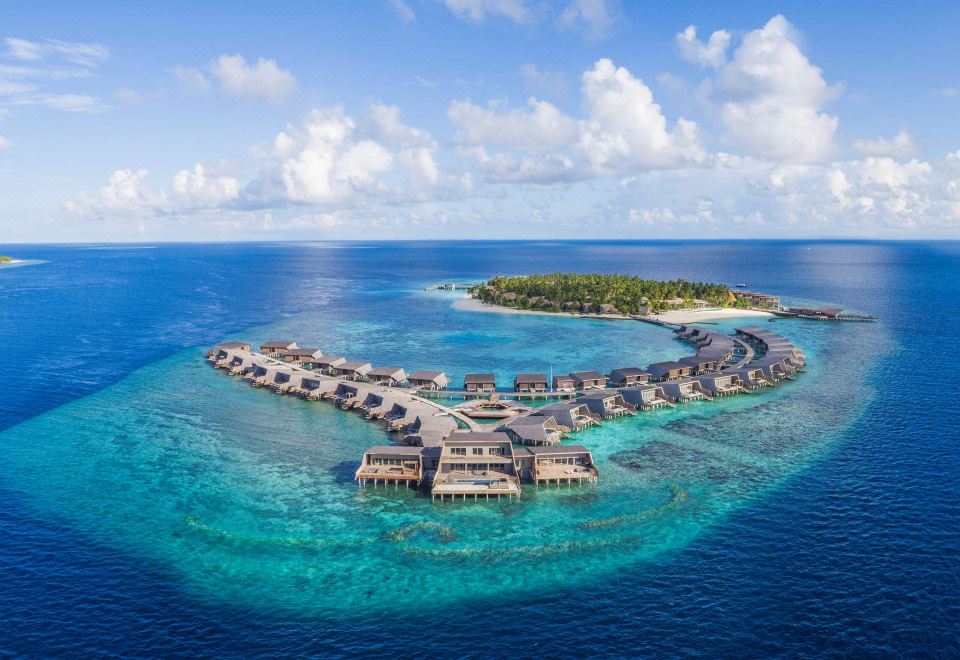 aerial view of a luxury resort on an island in the middle of the ocean at The St. Regis Maldives Vommuli Resort