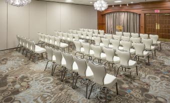 a conference room with rows of chairs arranged in a semicircle , ready for a meeting or presentation at Ashworth by the Sea