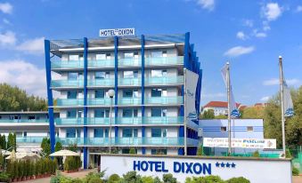 a large hotel with a blue and white facade is shown in front of the hotel at Hotel Dixon so Vstupom do bazéna a vírivky Zdarma - Free Entrance to Pool and Jacuzzi Included