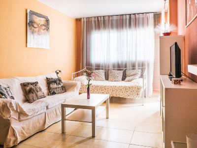 a cozy living room with two couches , one on the left and one on the right at Lanzarote