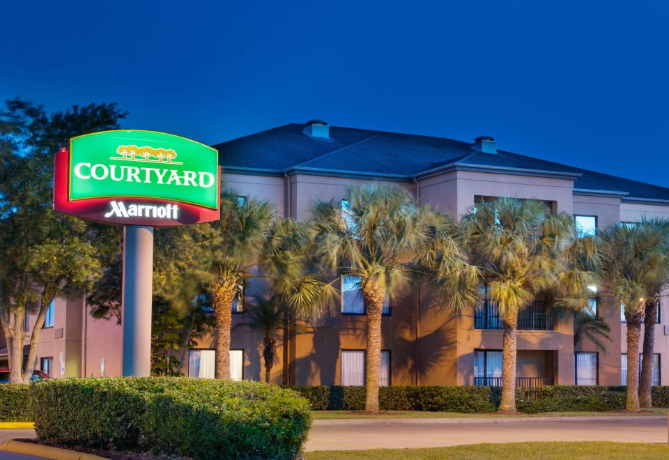 "a brick building with a sign that reads "" courtyard by marriott "" prominently displayed on the front of the building" at Courtyard Harlingen