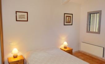 a bedroom with two beds , one on the left side and the other on the right side of the room at Holiday Home Villa Isabelle