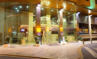 a hotel entrance with a glass door and a sign above it , surrounded by lights at Only You Hotel Valencia