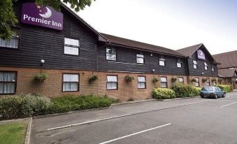 "a brick building with a purple sign that reads "" premier inn "" prominently displayed on the side of the building" at Premier Inn Maidstone (West Malling) hotel