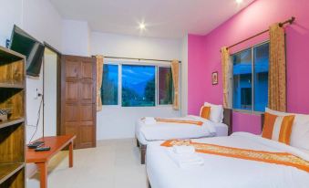 a modern hotel room with two beds , a window , and a balcony , all decorated in pink and white colors at Aurora Resort Chiangdao