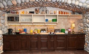 a kitchen with a variety of food items and utensils , such as bowls , cups , and spoons at Hilton Grand Vacations Club Blue Mountain Canada