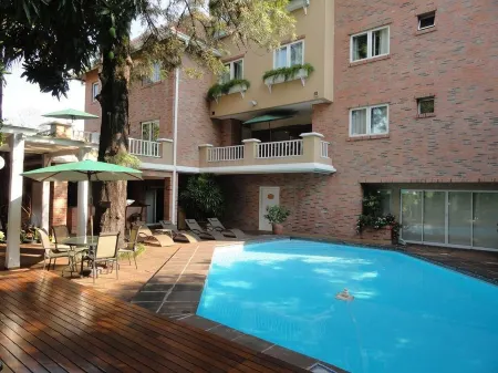 Hotel Villa Morra Suites Отели рядом с достопримечательностью «Ботанический сад Асунсьона»