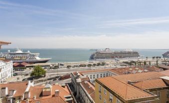 Altido Bright 2Br Apt with River Views &Balcony in Alfama, Moments from Santa Apolonia Train Station