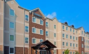 a large hotel with a red and white color scheme , located in a city setting at Staybridge Suites Philadelphia Valley Forge 422