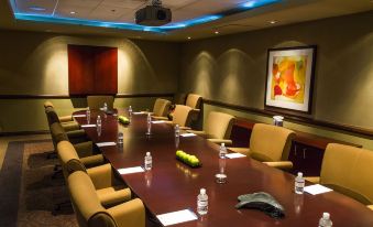 a conference room with a long table , chairs , and water bottles set up for a meeting at Desert Diamond Casino