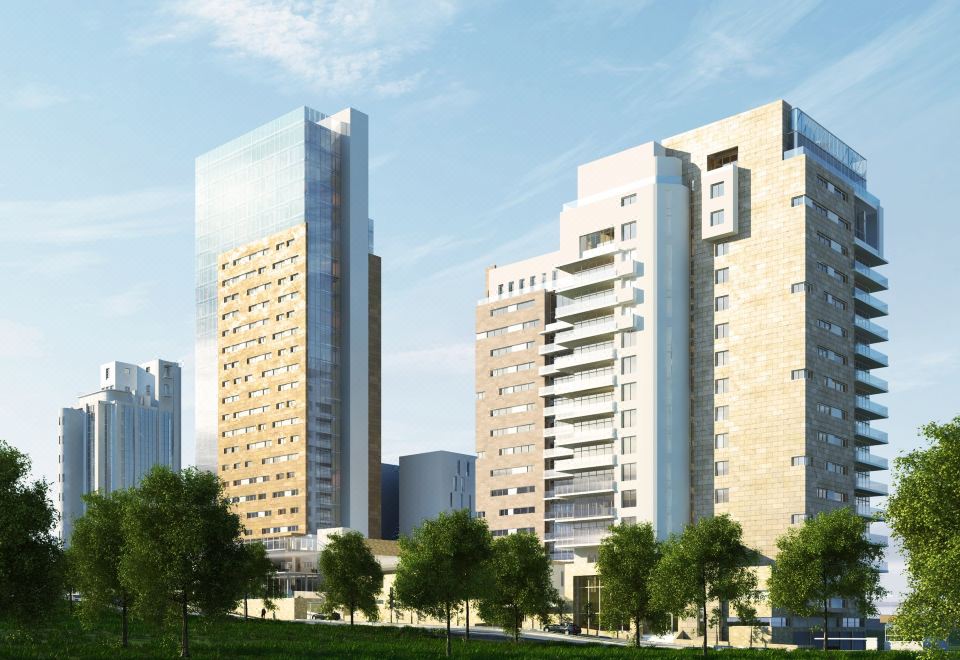 a city street with a tall building in the background and a large crowd of people at Holiday Inn Algiers - Cheraga Tower