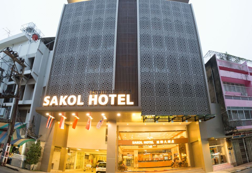 the entrance of the sakol hotel , a modern and stylish hotel in japan , with its name displayed prominently at Sakol Hotel