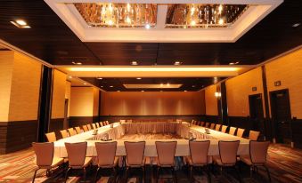 a large conference room with multiple tables and chairs arranged for a meeting or event at M Resort Spa & Casino
