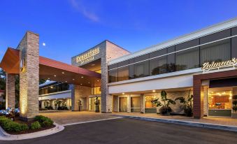"a large , modern building with the name "" doubletree by hilton "" displayed above the entrance" at The Kingsley Bloomfield Hills - a DoubleTree by Hilton