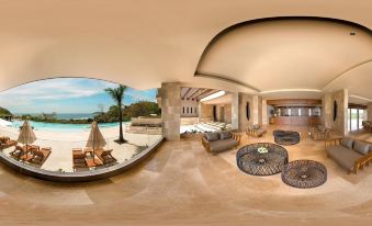 a 3 6 0 - degree panoramic view of a living room with lounge chairs , a couch , and a dining table at Wyndham Tamarindo