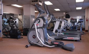 A spacious room in the center is equipped with treadmills and exercise equipment for everyone at Hotel Pennsylvania