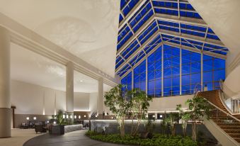 a modern building with a large glass ceiling , allowing natural light to illuminate the interior at The Westin Rusutsu Resort