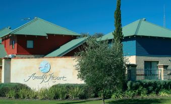 a sign for the luxury hotel amirihi resort is displayed in front of a building at Amalfi Resort