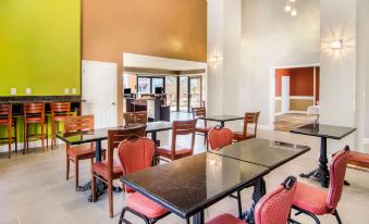 a dining room with tables and chairs arranged for a group of people to enjoy a meal together at Quality Inn