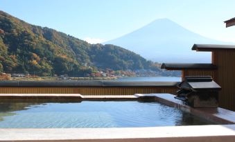 The pool at a Japanese tea house in Kyoto offers a scenic view of the mountains at Fuji Ginkei