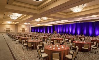 a large banquet hall with numerous tables and chairs arranged for a formal event or a wedding reception at The Westin Rancho Mirage Golf Resort & Spa