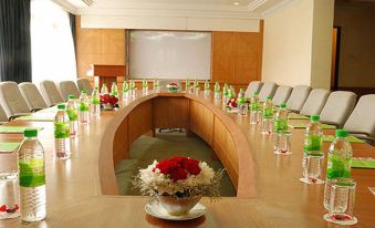 a conference room set up for a meeting , with a long table and chairs arranged in a semicircle at Strawberry Park Resort