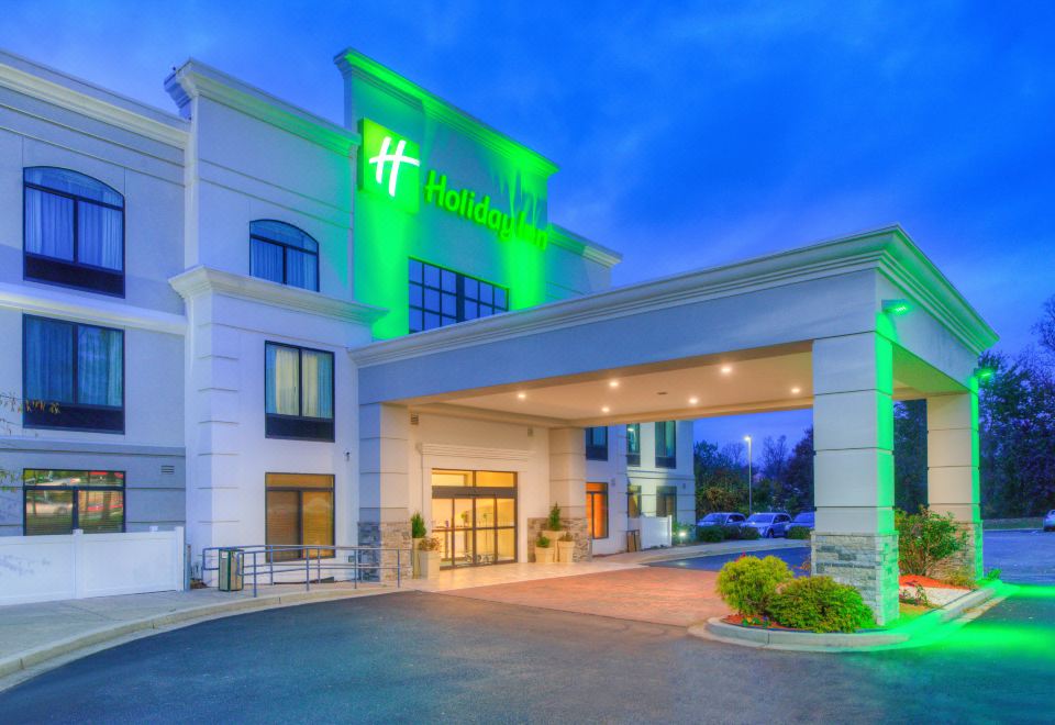 "a large , white and green hotel with a green sign that says "" holiday inn "" on it" at Holiday Inn Belcamp - Aberdeen Area