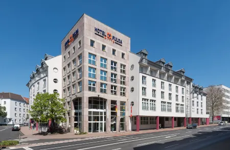 Hotel Fulda Mitte Отели в г. Кюнцелль