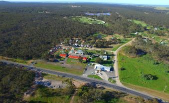 a bird 's eye view of a residential area with green grass and trees in the background at Inglewood Motel and Caravan Park Victoria