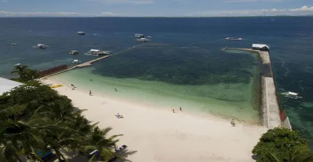 Costabella Tropical Beach Hotel Отели рядом с достопримечательностью «Мактан»